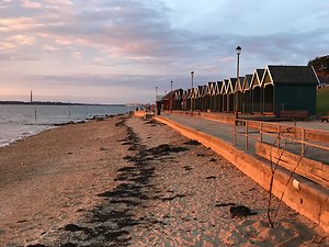 Home. beach huts sunset